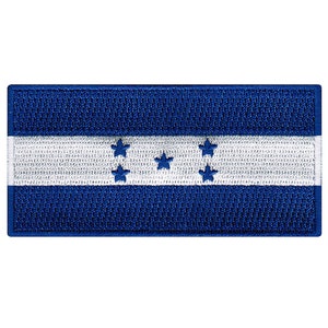 May include: A blue and white embroidered patch featuring the flag of Honduras. The flag has a white horizontal stripe with five blue five-pointed stars in the center, and two blue stripes above and below the white stripe.