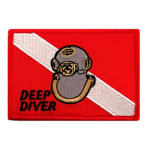 May include: Red and white scuba diving flag with a gray diving helmet and the text "DEEP DIVER" in black.