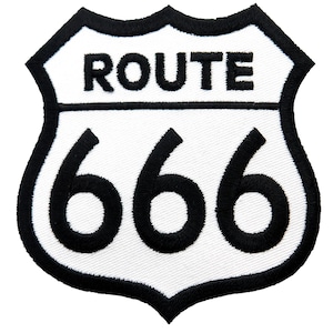 May include: White and black embroidered patch with a classic highway sign shape. The sign reads "ROUTE 666".