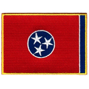 May include: A red embroidered patch with a blue circle containing three white stars. The patch has a yellow border and a blue stripe on the right side.