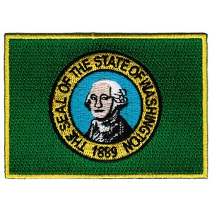 May include: An embroidered patch in green with a yellow border, showing the seal of the state of Washington. The seal features a portrait of George Washington and the text "The Seal of the State of Washington 1889".