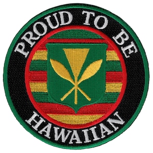 May include: A round, black and white embroidered patch with the words "Proud to be Hawaiian" around the edge. The center of the patch features the Hawaiian flag with a green shield and a yellow flower.