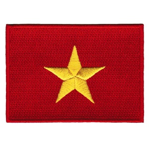May include: A red embroidered patch with a large yellow five-pointed star in the center.