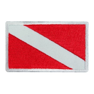 May include: Embroidered rectangular patch featuring a red background with a white diagonal stripe. The patch has a white border. This patch is a diving flag, used to indicate a diver is in the water.