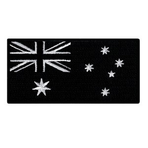 May include: A black rectangular patch embroidered with the Australian flag. The design features the Union Jack in the top left corner and the Southern Cross constellation on the right. The flag's details are in white.