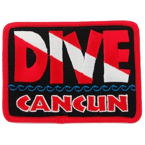 May include: Red, white, and blue embroidered patch with the word "DIVE" and the text "CANCUN" below. The patch has a black background and a red border.