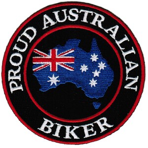 May include: A black and red embroidered patch with a white outline. The patch features a map of Australia with the Australian flag in the top left corner. The text "Proud Australian Biker" is written around the outside of the patch.