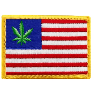 May include: A green marijuana leaf on a blue background with a red, white, and blue American flag. The flag is surrounded by a yellow border.