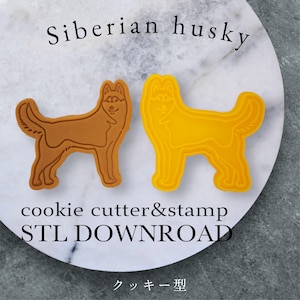 Könnte beinhalten: Zwei Ausstecher für Siberian Husky-Kekse, einer braun und einer gelb, werden auf einer Marmoroberfläche gezeigt. Der Text "Siberian husky" steht über den Ausstechern, darunter "cookie cutter&stamp" und "STL DOWNLOAD". Japanischer Text unten.