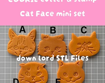 Puede incluir: Un conjunto de cinco cortadores y sellos de galletas con forma de cara de gato naranja. Cada cortador presenta un diseño de cara de gato diferente, etiquetado de la A a la E. El texto "COOKIE cutter & stamp" y "Cat Face mini set" están visibles.