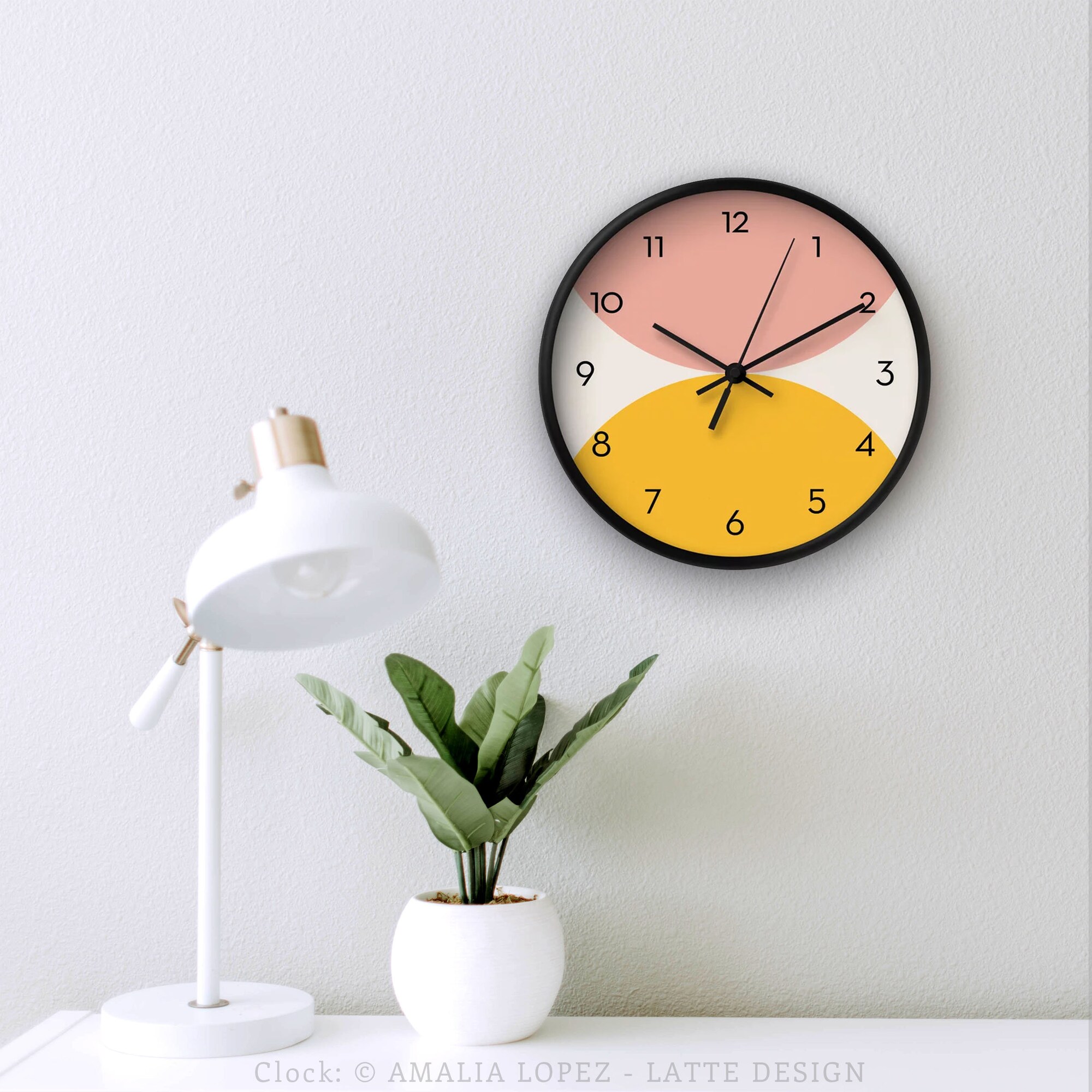 Yellow and pink wall clock. Mid century modern clock