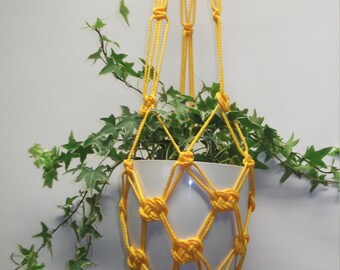 Orange yellow macrame plant hanger. Hanging planter. Hanging flowerpot holder.