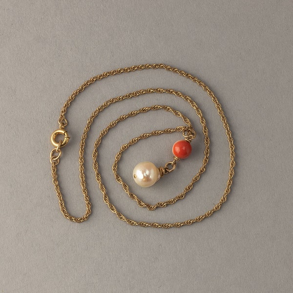 Pendant of salmon coral and baroque freshwater pearl on a  gold filled chain.  Vintage 1970s. pdvn809