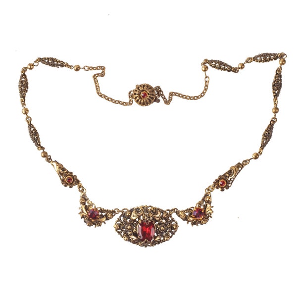 Early 20th c. necklace of layered brass and glass stones.  nled500