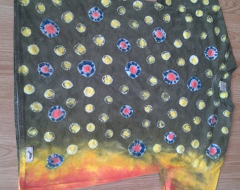 May include: A green, yellow, and orange tie-dye t-shirt with a pattern of blue, red, and yellow circles.