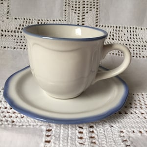 Vintage coffee cup and saucer with light blue rims