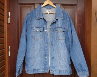 May include: A blue denim jacket with a button closure and two front pockets.