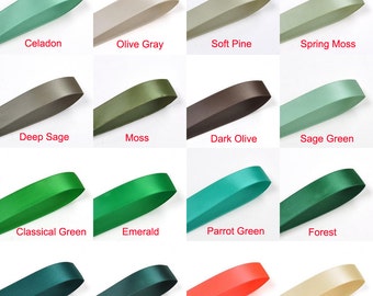 May include: A collection of 16 satin ribbon samples in various shades of green, including celadon, olive gray, soft pine, spring moss, deep sage, moss, dark olive, sage green, classical green, emerald, parrot green, forest, hunter, spruce, neon orange, and chamois.