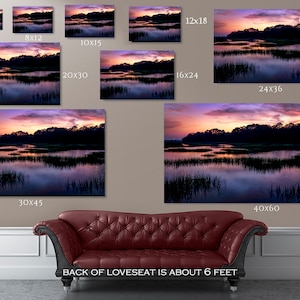 May include: A canvas print of a sunset over a marsh with a reflection of the sky in the water. The print is available in various sizes, including 5x7 inches, 8x12 inches, 10x15 inches, 12x18 inches, 16x24 inches, 20x30 inches, 24x36 inches, 30x45 inches, and 40x60 inches.