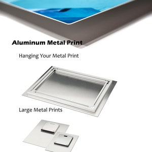 May include: Aluminum metal print hanging system.  The image shows a large metal print with a hanging system on the back.  The image also shows a smaller metal print with a hanging system on the back.  The text "Aluminum Metal Print" is at the top of the image.  The text "Hanging Your Metal Print" is below the text "Aluminum Metal Print".  The text "Large Metal Prints" is below the image of the large metal print.  The text "Small Metal Prints" is below the image of the small metal print.