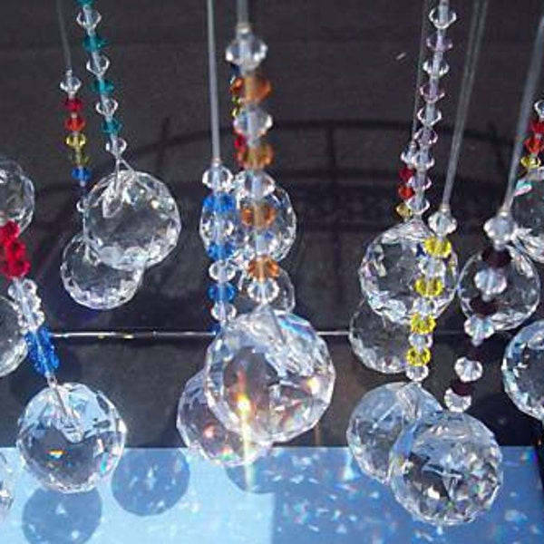 Suncatchers that create beautiful rainbows made to order in all genuine swarovski crystal colors.