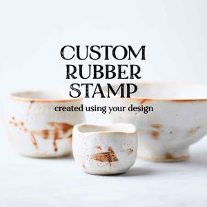 May include: The image showcases three ceramic vessels with a rustic aesthetic. The text "CUSTOM RUBBER STAMP" is displayed above "created using your design". The vessels are white with brown accents, suggesting a handmade or artisanal quality.