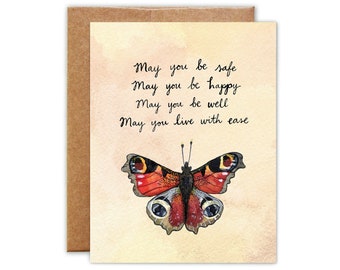 Puede incluir: Una tarjeta de felicitación con una ilustración de acuarela de una mariposa con alas rojas, negras y blancas. La tarjeta tiene un mensaje escrito a mano que dice: "Que estés seguro, Que seas feliz, Que estés bien, Que vivas con facilidad".