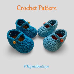 May include: Four pairs of baby Mary Jane shoes in a light blue crochet pattern. Each shoe has a strap with a button closure. The text "Crochet Pattern" is in orange at the top of the image, and "TatjanaBoutique" is at the bottom.