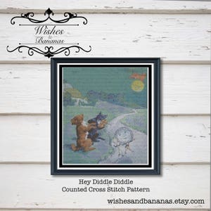 May include: Counted cross stitch pattern of the nursery rhyme "Hey Diddle Diddle" featuring a cat playing a fiddle, a cow jumping over the moon, a little dog laughing, and a dish running away with a spoon. The pattern is in a black frame with a white mat.