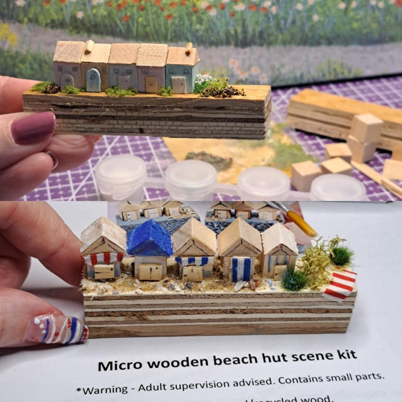 May include: A micro wooden beach hut scene kit. The kit includes miniature beach huts with colorful roofs and striped details, set on a wooden base. The text "Micro wooden beach hut scene kit" is visible.
