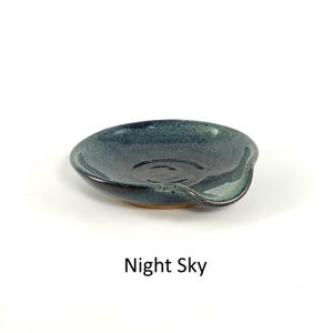 Night Sky glaze, handcrafted spoon rest, shallow round shape with notch for spoon handle, formed on a potter's wheel.