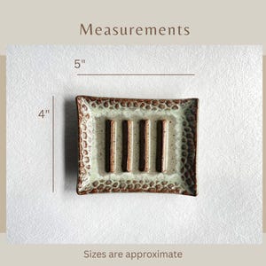 A Seafoam Green Soap Dish showing measurements:
Five inches wide and four inches tall.
Sizes are approximate