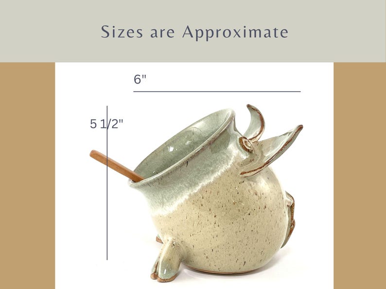 A Seafoam Green Salt Pig with wooden spoon showing measurements:
6" long and 5 1/2" tall.
Sizes are approximate.