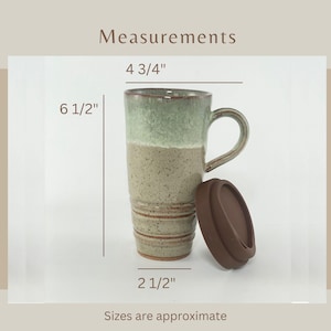 A Seafoam Green Travel Mug with Lid showing measurements:
4 3/4" across the handle.
6 1/2" tall.
2 1/2" across the bottom.