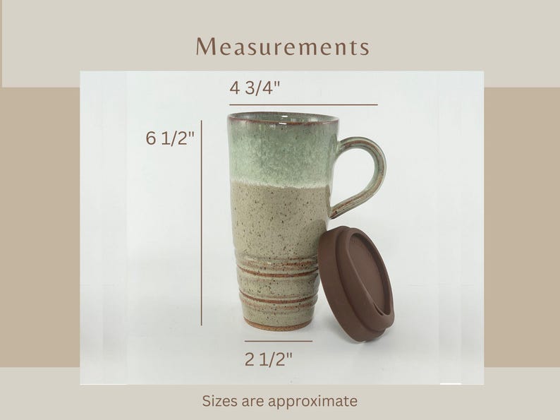 A Seafoam Green Travel Mug with Lid showing measurements:
4 3/4" across the handle.
6 1/2" tall.
2 1/2" across the bottom.