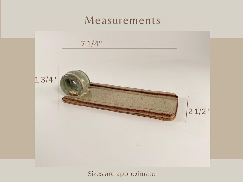 May include: A ceramic incense holder with a light green cylindrical incense holder and a rectangular tray. The tray is approximately 18.4 cm long and 6.4 cm wide. The incense holder is 4.4 cm tall. The text "Measurements" is visible.