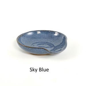 Sky Blue handcrafted spoon rest, shallow round shape with notch for spoon handle, formed on a potter's wheel.