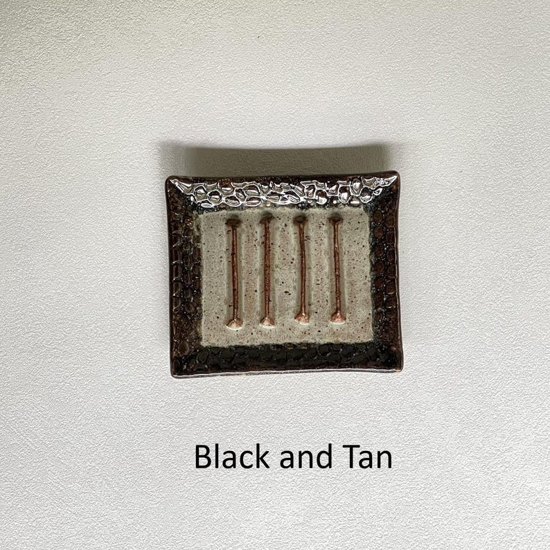 A Black and Tan Soap Dish.
