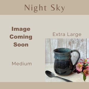 Showing places for two Night Sky Banded Belly Mugs, one sized Medium and the other sized Extra Large. The Medium is labeled Image coming soon The Extra Large is showing.