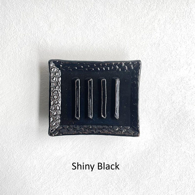 A Shiny Black Soap Dish.
