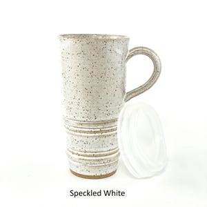 A Speckled White Travel Mug with Lid
