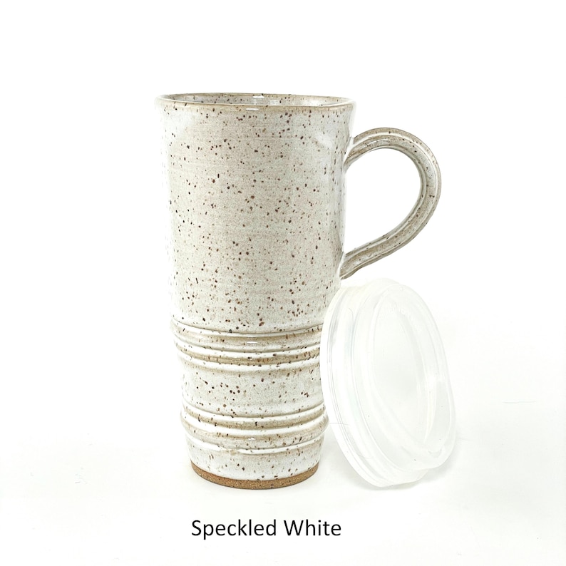 A Speckled White Travel Mug with Lid