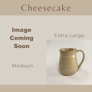 Showing places for two Cheesecake Banded Belly Mugs, one sized Medium and the other sized Extra Large. The Medium is labeled Image coming soon The Extra Large is showing.
