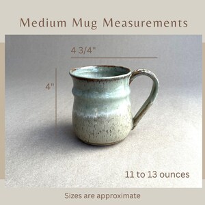 Titled Medium Mug Measurements, showing a Medium Seafoam Green Banded Belly Mug with measurements 4 3/4" across the handle, 4" high, and 11 to 13 ounces of capacity. Sizes are approximate.