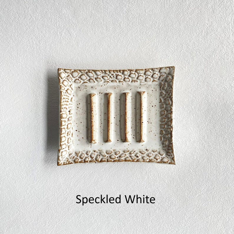 A Speckled White Soap Dish.