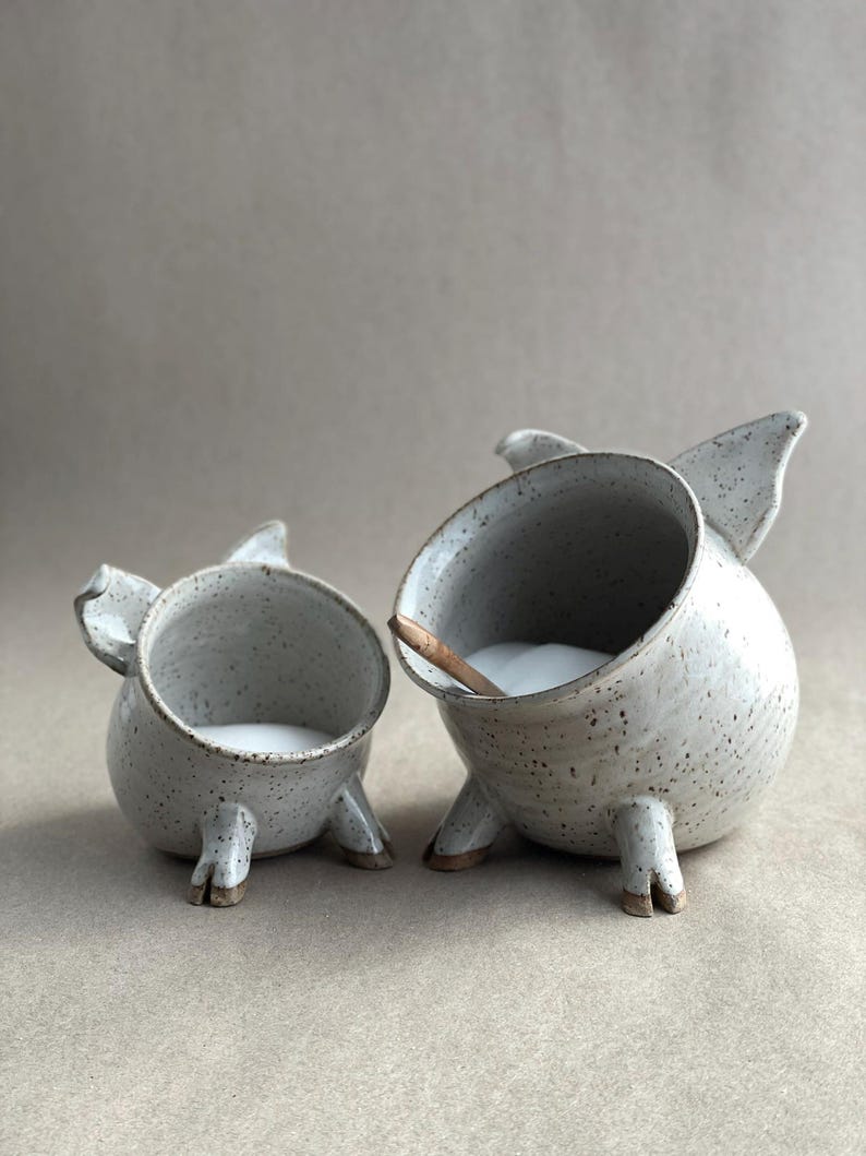 Two Speckled White Salt Pigs. One Salt Pig of regular size and a smaller Half Size Salt Pig