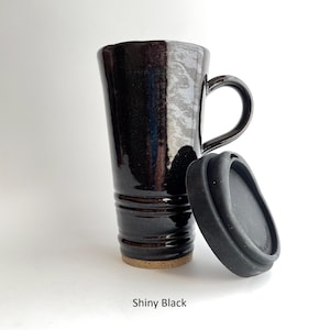 A Shiny Black Travel Mug with Lid