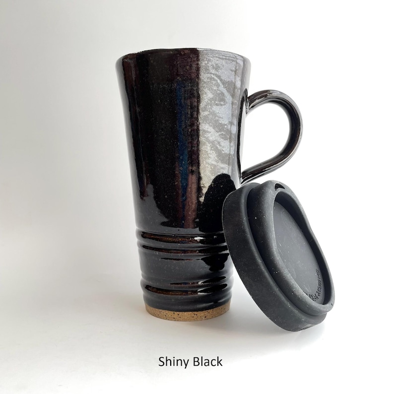 A Shiny Black Travel Mug with Lid