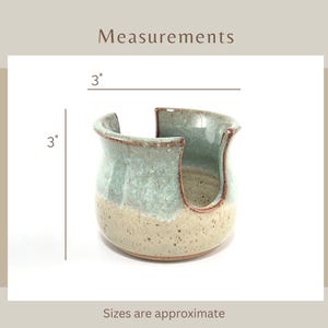 Showing a Seafoam Green Cup Dispenser with approximate measurements of 3 inches tall and 3 inches wide.