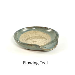 Flowing Teal handcrafted spoon rest, shallow round shape with notch for spoon handle, formed on a potter's wheel.